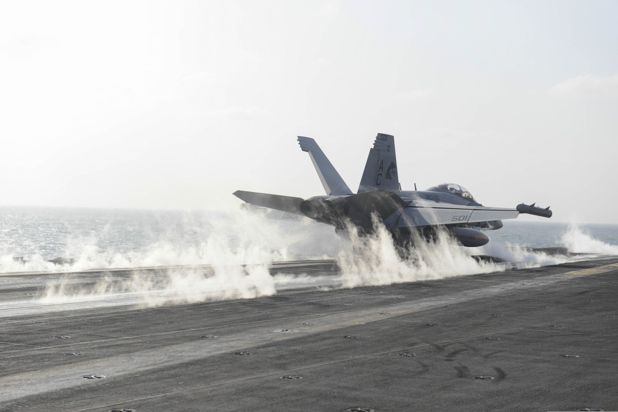 EA-18G Growler launching from a carrier flight deck
