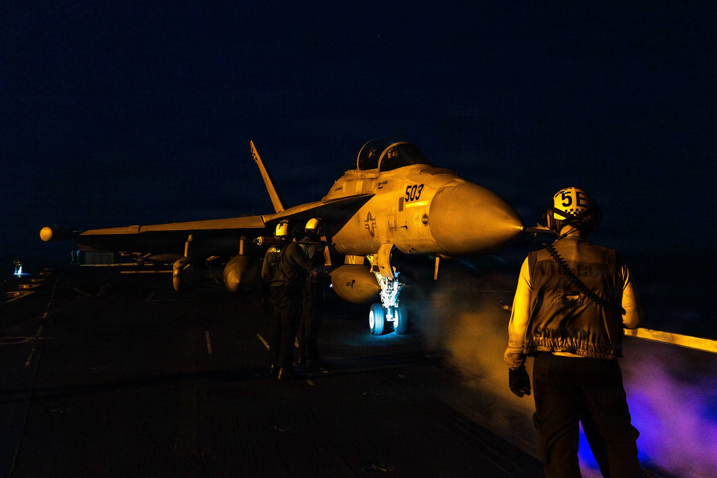 Night flight operations on a carrier deck
